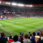 Exciting koora live football match with enthusiastic fans in a stadium.
